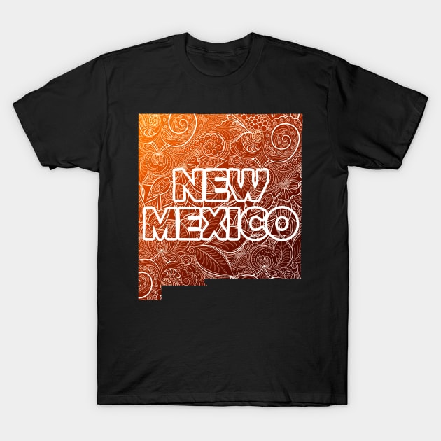 Colorful mandala art map of New Mexico with text in brown and orange T-Shirt by Happy Citizen